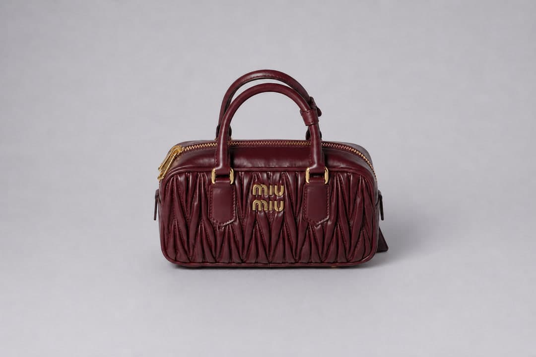 Burgundy handbag supplied for Accessories Try-On.