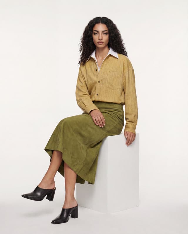 Seated shot from the coherent editorial series.